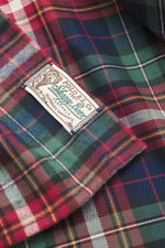 Close-up image from a top angle of the Polo Ralph Lauren Flannel shirt narrow collar multicolor checkered, showing its classic check pattern, flannel made of pure cotton, soft touch, regular fit, narrow collar, patch chest pockets with flap, patch button 