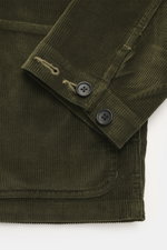 Close-up front view of Polo Ralph Lauren Cord overshirt olive sleeve and hem, corduroy made from pure cotton, soft touch, slim fit, turn-down collar, five-button placket, patch chest pocket with logo stitching, patch front pockets, sleeve cuffs with butto