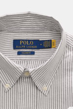 Close-up front view of Polo Ralph Lauren Oxford Shirt Button-Down Collar Black/White Striped showing button-down collar, striped pattern, and brand label inside collar. Stylish classic with attention to detail: This sporty shirt from POLO RALPH LAUREN is 