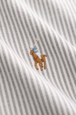 Close-up front view of Polo Ralph Lauren Oxford Shirt Button-Down Collar Black/White Striped, showing pure cotton fabric with classic stripes, multicolor chest logo embroidery, and textured weave, highlighting details like button placket and pleat at the 