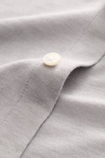 Close-up front view of Sonrisa Jersey shirt shark collar grey showing soft cotton-lyocell fabric texture and mother-of-pearl button.

<p>Comfort meets style: This jersey model in a soft cotton-lyocell blend by SONRISA adds a touch of elegance to any smart