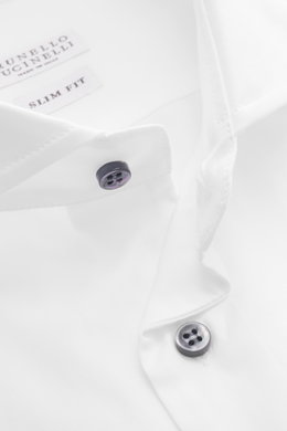 Close-up top-down view of the Brunello Cucinelli Casual Shirt Shark Collar White showing pure cotton gabardine fabric, slim fit, French placket, contrasting mother-of-pearl buttons, shark collar, classic sport cuff, and slightly rounded hemline.

Addition