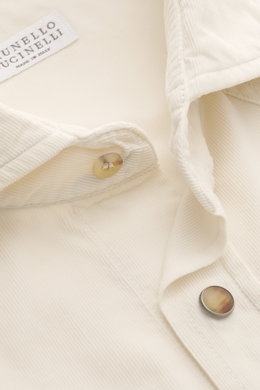 Close-up front view of the Brunello Cucinelli Cord Shirt Shark Collar Cream, showcasing fine cotton corduroy, soft touch, slim fit, shark collar, patch breast pockets with curved flap, patch snap button placket, classic sport cuff, western-style shoulder 