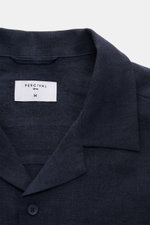 Close-up front view of the Percival Short sleeve shirt Cuban collar navy, showcasing its pure linen fabric, Cuban collar, and smooth button placket. Relaxed summer style: With its lightweight linen fabric, this short sleeve shirt by PERCIVAL is a must-hav