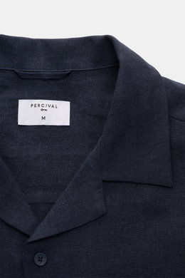 Close-up front view of the Percival Short sleeve shirt Cuban collar navy, showcasing its pure linen fabric, Cuban collar, and smooth button placket. Relaxed summer style: With its lightweight linen fabric, this short sleeve shirt by PERCIVAL is a must-hav
