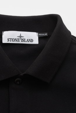 Close-up front top view of Stone Island Poloshirt schwarz, a classic black polo made from pure cotton piqué with a structured feel, garment dyed, slim fit, typical polo collar, smooth button placket, Stone Island web label, flexible sleeve cuffs, and side