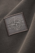 Close-up view of the Stone Island Poloshirt dunkelgrau showing the textured cotton piqué fabric and the embroidered Stone Island web label.

Description: <p>Das moderne Piqué-Poloshirt von STONE ISLAND ist ein vielseitiger Klassiker aus elastischer Baumwo