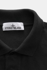 Close-up front view of Stone Island Jersey polo shirt black collar and label, made of soft pure cotton jersey in slim fit.

Description: <p>This lightweight polo shirt is a must-have for sporty men’s wardrobes: Made of cotton jersey, this timeless model b