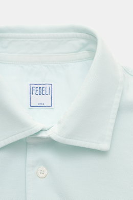 Close-up front view of the Fedeli Poloshirt 'North' mintgrün showing the slim fit, typical polo collar, and pearl button placket.

<p>Quiet Luxury: Das cleane Poloshirt 'North' aus hochwertigem Baumwoll-Piqué von FEDELI kommt ganz ohne Logos aus und wurde