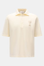 Front view of Ami Paris Polo shirt cream, a casual classic piqué cotton polo with three-button placket, oversized fit, and 3D ‘A’ logo stitching on chest. 

<p>A casual classic among polo shirts: This piqué model in pure cotton with three-dimensional ‘A’ 