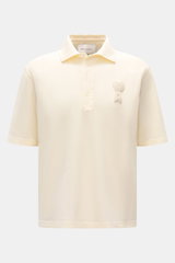 Front view of Ami Paris Polo shirt cream, a casual classic piqué cotton polo with three-button placket, oversized fit, and 3D ‘A’ logo stitching on chest. 

<p>A casual classic among polo shirts: This piqué model in pure cotton with three-dimensional ‘A’ 