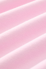 Nahaufnahme des elastischen Baumwoll-Piqué-Stoffs in zartem Rosé des MC2 Saint Barth Poloshirts 'Charles', Detailstruktur erkennbar.