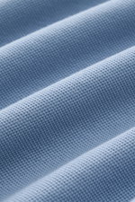 MC2 Saint Barth Polo shirt 'Charles' smoky blue fabric close-up from an angled perspective, showing pure piqué cotton texture with elasticated, soft feel.