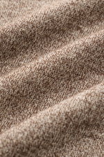 Close-up fabric detail of the Filippo de Laurentiis Kurzarm-Strickpolo 'Skipper' braun/creme meliert, showing its fine brown and cream melange knit texture from a top-down perspective, highlighting its soft, linen-cotton mix with a smooth feel. For casual