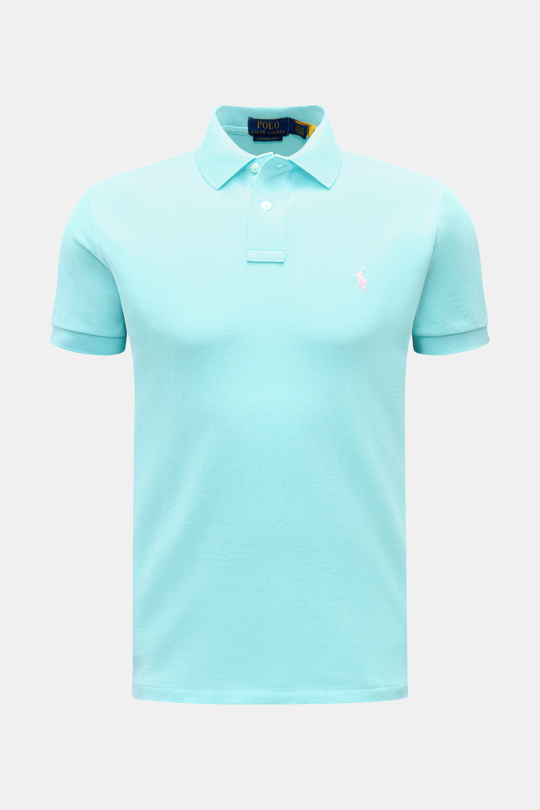 Front view of a slim fit Polo Ralph Lauren Polo shirt light blue made of pure cotton piqué with a signature collar, two-button placket, elasticated cuffs, side vents, and iconic polo rider logo stitching on the chest. 

<p>The classic among polo shirts si
