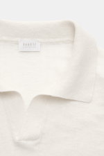 Close-up front view of 04651/ A trip in a bag Short sleeve knit polo 'Johnny' cream, showing the classic collar and open collar strip.

Description: <p>Modern classic: This short sleeve knit polo by 04651/ A TRIP IN A BAG has a clean striped look that mak