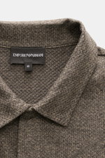 Close-up front view of Emporio Armani Jersey Polo Shirt Gray Brown Melange collar with label and textured jersey fabric.

Description: <p>Sporty casualness: The EMPORIO ARMANI polo shirt combines comfortable quality with casual jersey design and fits a va