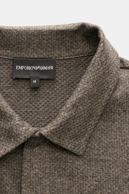 Close-up front view of Emporio Armani Jersey Polo Shirt Gray Brown Melange collar with label and textured jersey fabric.

Description: <p>Sporty casualness: The EMPORIO ARMANI polo shirt combines comfortable quality with casual jersey design and fits a va
