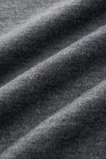 Close-up front view of von Braun Merino knit polo anthracite mottled fabric showing very fine knit texture in dark grey tones.

<p>An elegant basic for casual looks: This VON BRAUN knit polo with open collar placket is a casual alternative to a fine knit 