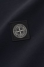 Close-up front view of Stone Island Long sleeve polo shirt dark navy showing tonal compass logo patch on garment-dyed pure cotton piqué fabric.

<p>Create casual outfits that work with this classic long sleeve polo shirt in an understated sporty look in p