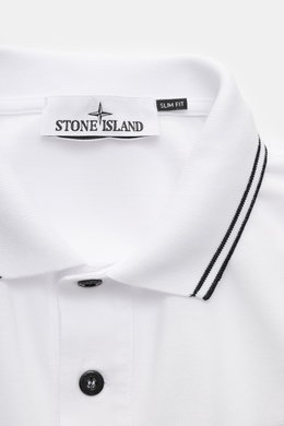 Close-up front view of Stone Island Long sleeve polo shirt white showing collar with black stripes, button placket, and fabric labels.

<p>Create casual outfits that work with this classic long sleeve polo shirt in an understated sporty look in piece-dyed