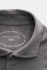 Close-up top-down view of the Fedeli Jersey Longsleeve Polo Shirt 'Zero' grey collar, showing soft Giza cotton fabric and mother-of-pearl buttons.