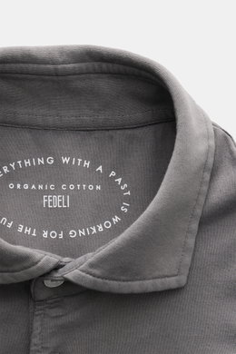 Close-up top-down view of the Fedeli Jersey Longsleeve Polo Shirt 'Zero' grey collar, showing soft Giza cotton fabric and mother-of-pearl buttons.