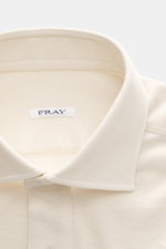 Close-up front view of the Fray Jersey longsleeve polo shirt 'Parigi' cream, showcasing the classic polo collar, four-button placket, and regular fit with a soft feel from a mix of cotton and cashmere, featuring classic sport cuffs.