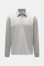 Front view of Ami Paris Jersey longsleeve polo shirt grey melange with oversized fit, tailored collar, three-button placket, and logo stitching.

Description: 
<p>Contemporary casualness: With its generous oversized fit, the long sleeve polo shirt from AM