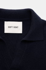 Close-up front view of Soft Goat Cashmere knit polo navy showing open collar placket and medium-fine knit texture in pure cashmere.

Description: <p>Pared down to the essentials: This long sleeve knit polo in pure cashmere by SOFT GOAT has a simple design