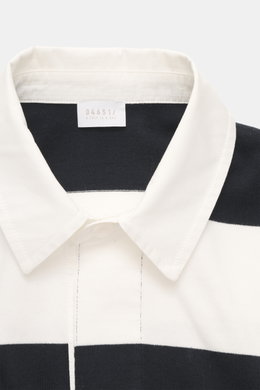 Close-up front view of the 04651/ A trip in a bag Jersey Long Sleeve Polo Shirt dark navy/white striped showing pure cotton jersey, soft touch, heavy quality, block stripes, regular fit, fine polo collar, deep concealed three-button placket, and small wov