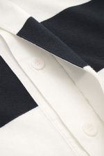 Close-up image from a top-down perspective of the 04651/ A trip in a bag Jersey Long Sleeve Polo Shirt dark navy/white striped showing the fine polo collar, deep concealed three-button placket, block stripes, soft touch, heavy quality, pure cotton jersey,