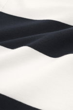 Close-up view of the fabric texture of 04651/ A trip in a bag Jersey Long Sleeve Polo Shirt dark navy/white striped, showing block stripes, jersey made of pure cotton, soft touch, heavy quality, regular fit, fine polo collar, deep concealed three-button p