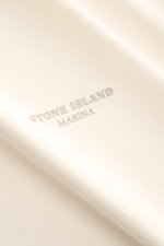 Stone Island Rundhals-T-Shirt 'Marina' creme, Detailfoto Logo-Print, weiche Baumwolle, Oversized Fit, Rippstrick-Schulter, schwere Qualität.