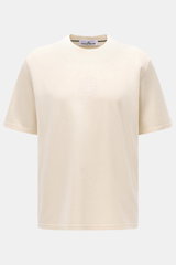 Stone Island Rundhals-T-Shirt creme, frontal fotografiert, aus schwerer Baumwolle mit weichem Griff, Regular Fit, Logo-Print vorne, plakativer Rückenprint.