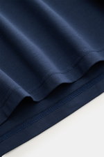 Close-up view of the hem and stitching of the mey story Rundhals-T-Shirt navy, made from soft, smooth, and stretchy mercerized cotton jersey with a slim fit and round neckline.