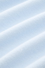 Close-up front view of pastel blue terrycloth fabric showing soft texture of 04651/ A trip in a bag Terry T-shirt 'Terry Tee' made of pure cotton. 

<p>The clean T-shirt 'Terry Tee' by 04651/ A TRIP IN A BAG is made of soft terry in pure cotton fabric and