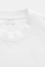 Close-up front view of the 04651/ A trip in a bag T-Shirt 'Nunu' white showing crew neck and label.

Description: A basic with a print accent: With its minimalist holiday print, this T-shirt by 04651/ A TRIP IN A BAG makes a modern statement and is the id