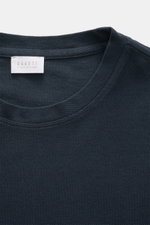 Close-up front view of the navy 04651/ A trip in a bag Piqué T-shirt showing the crew neck, woven label, and textured piqué cotton fabric.

<p>Summer essential: This piqué T-shirt from 04651/ A TRIP IN A BAG is a versatile staple that's perfect for warm d