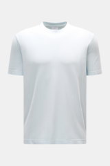 Front view of the 04651/ A trip in a bag Piqué T-shirt pastel blue, made of pure piqué cotton with a slim fit, crew neck, ribbed bands, and woven label in the side seam, offering a robust feel perfect for warm days.