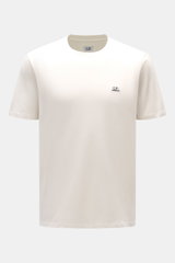 Front view of the C.P. Company Crew Neck T-Shirt offwhite, slim fit with pure cotton jersey, soft touch, crew neckline, and subtle logo patch on chest.