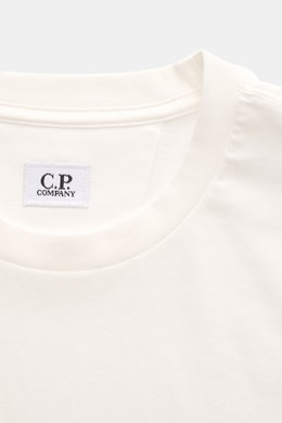 C.P. Company Crew Neck T-Shirt offwhite shown from a close-up front view, featuring a soft, pure cotton jersey, slim fit, crew neckline, and subtle logo patch on the chest. 

<p>C.P. COMPANY gives this classic T-shirt its unmistakable signature note with 
