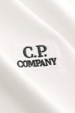 Close-up front view of C.P. Company Crew Neck T-Shirt offwhite showing subtle logo stitching on soft, pure cotton jersey fabric.

Description: 
<p>C.P. COMPANY gives this classic T-shirt its unmistakable signature note with a subtle logo stitching on the 
