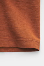 Close-up front view of Stone Island Crew Neck T-Shirt 'Ghost Piece' rust brown showing smooth cotton jersey fabric and stitching detail.

<p>With this crew neck T-shirt made of smooth cotton jersey, featuring a tonal woven label on the chest, STONE ISLAND