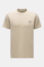 Front view of Stone Island Crew Neck T-Shirt 'Ghost Piece' beige, a slim fit, garment-dyed cotton jersey tee with smooth feel and tonal woven label on chest. 

Description: <p>With the crew neck T-shirt made of smooth cotton jersey, featuring a tonal wove