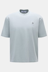 Front view of Stone Island Crew Neck T-Shirt 'Organic Cotton' smoky blue, showcasing pure organic cotton, soft feel, regular fit, crew neckline, and woven chest label.