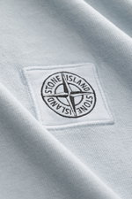 Close-up front view of Stone Island Crew Neck T-Shirt 'Organic Cotton' smoky blue showing woven chest label on soft, pure organic cotton fabric.

<p>Timeless, versatile, and sustainable: The STONE ISLAND t-shirt impresses as a modern casual essential. Mad