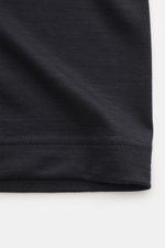 Close-up image from a front angle of the hem and fabric texture of the Emporio Armani Crew neck T-Shirt dark navy, featuring pure wool, soft feel, slim fit, and logo stitching on the chest.
