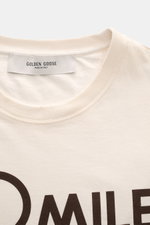 Golden Goose Crew Neck T-Shirt Cream shown from a close-up front perspective, featuring pure cotton, heavy quality, regular fit, crew neckline, and bold lettering on the front. 

A bold statement for warm days: The T-shirt by GOLDEN GOOSE stands out wit