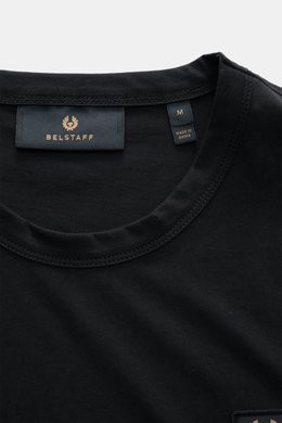 Belstaff Crew neck T-shirt black shown from a close-up top front perspective, featuring a slim fit, pure cotton jersey, soft feel, crew neck, and subtle BELSTAFF woven label. Uncomplicated and authentic, perfect for relaxed downtime looks.